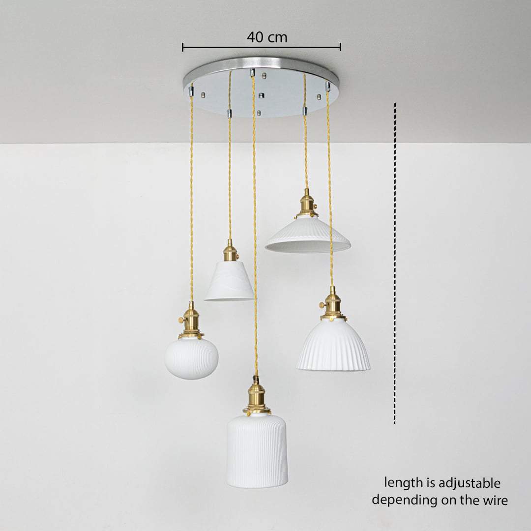 Adjustable ceramic pendant cluster with white textured shades and gold fittings shown with a clear hanging height guide for accurate display.