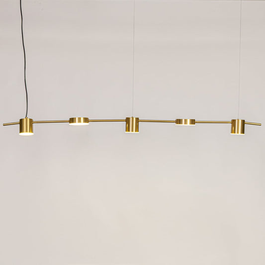 Gold linear pendant light displayed against a clean white background with lights on showcasing its warm glow and minimal modern style.
