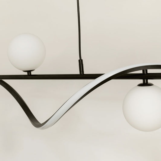 Closeup of black wave chandelier showing curved metal frame and white globe lights for premium modern detail.