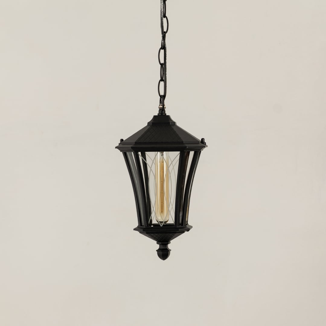 A black hanging outdoor lantern displayed on a plain white background with the light turned off highlighting its curved metal frame and clear glass panels.