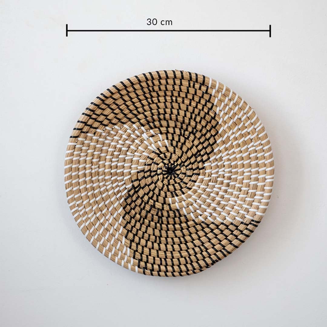Circular handwoven wall basket with spiral pattern in natural tones showing 30 cm diameter for decorative wall styling.