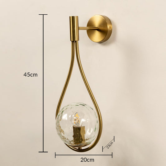 Brushed gold teardrop wall light measuring 45 cm by 20 cm with 23 cm depth shown clearly for accurate placement on modern interior walls.