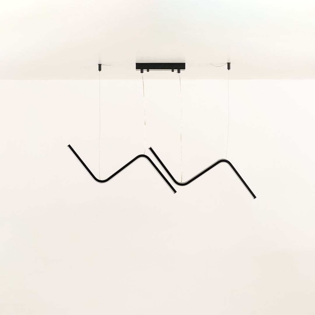 Black wave LED chandelier with sculptural flowing design ideal for large living rooms and modern interiors offering a bold artistic ceiling light statement.