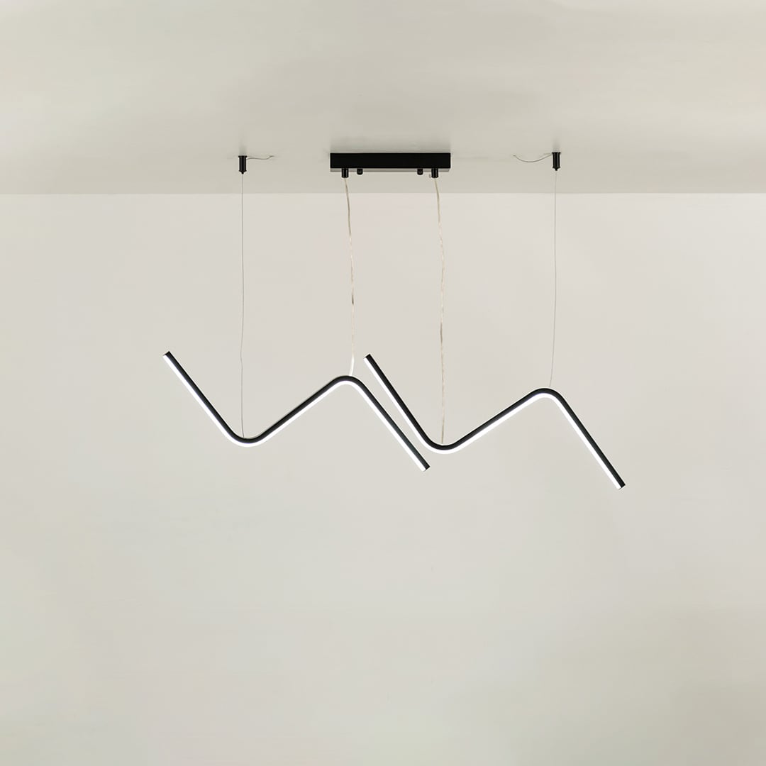 Black sculptural pendant chandelier with flowing wave shaped LED bars suspended gracefully creating a striking artistic statement that enhances modern interior design.