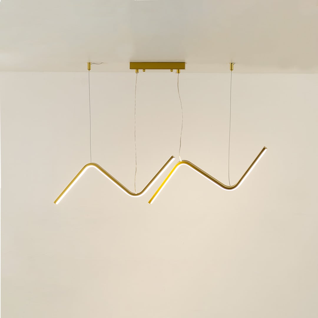 Gold wave LED chandelier with elegant sculptural design perfect for luxury interiors and dining rooms creating a warm artistic modern lighting centerpiece.