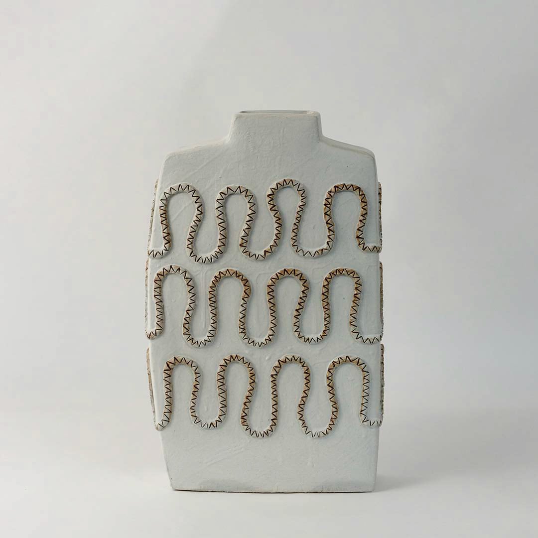 Modern square white ceramic vase with artistic zigzag carved design styled for elegant living room and office decoration.