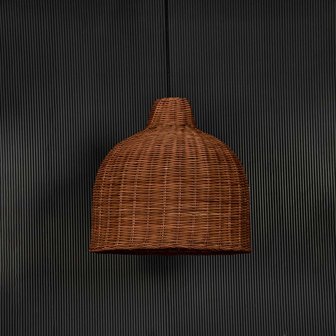 Rattan pendant light bulb off on black background with natural wicker dome design for bohemian home lighting decor.
