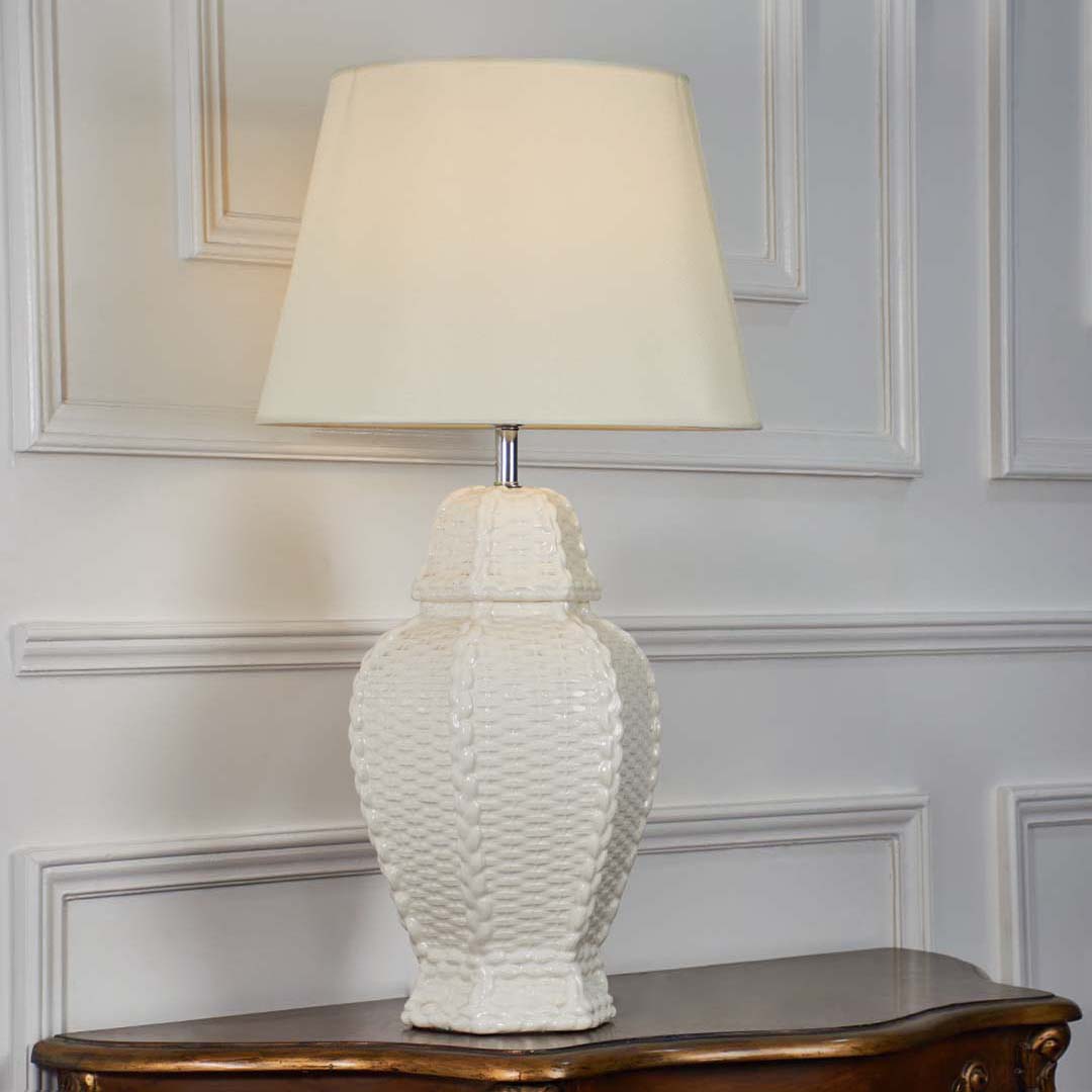 White ceramic textured table lamp with a cream fabric shade displayed on a plain white background ideal for modern elegant home decor styling.