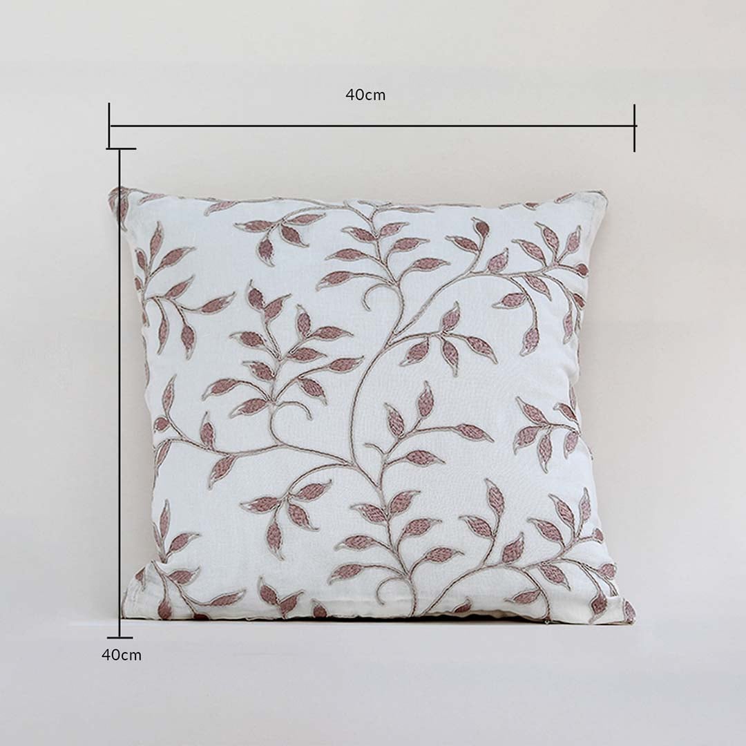 Cushion cover featuring a brown leafy pattern shown with height and width indicators displaying its 40 cm x 40 cm size aiding customers in choosing proper décor fit.