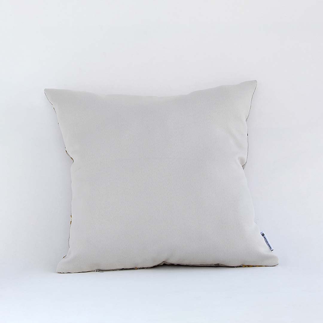 Soft beige cotton cushion cover photographed simply providing a clean minimal décor style with a smooth breathable and skin friendly texture suitable for modern homes.