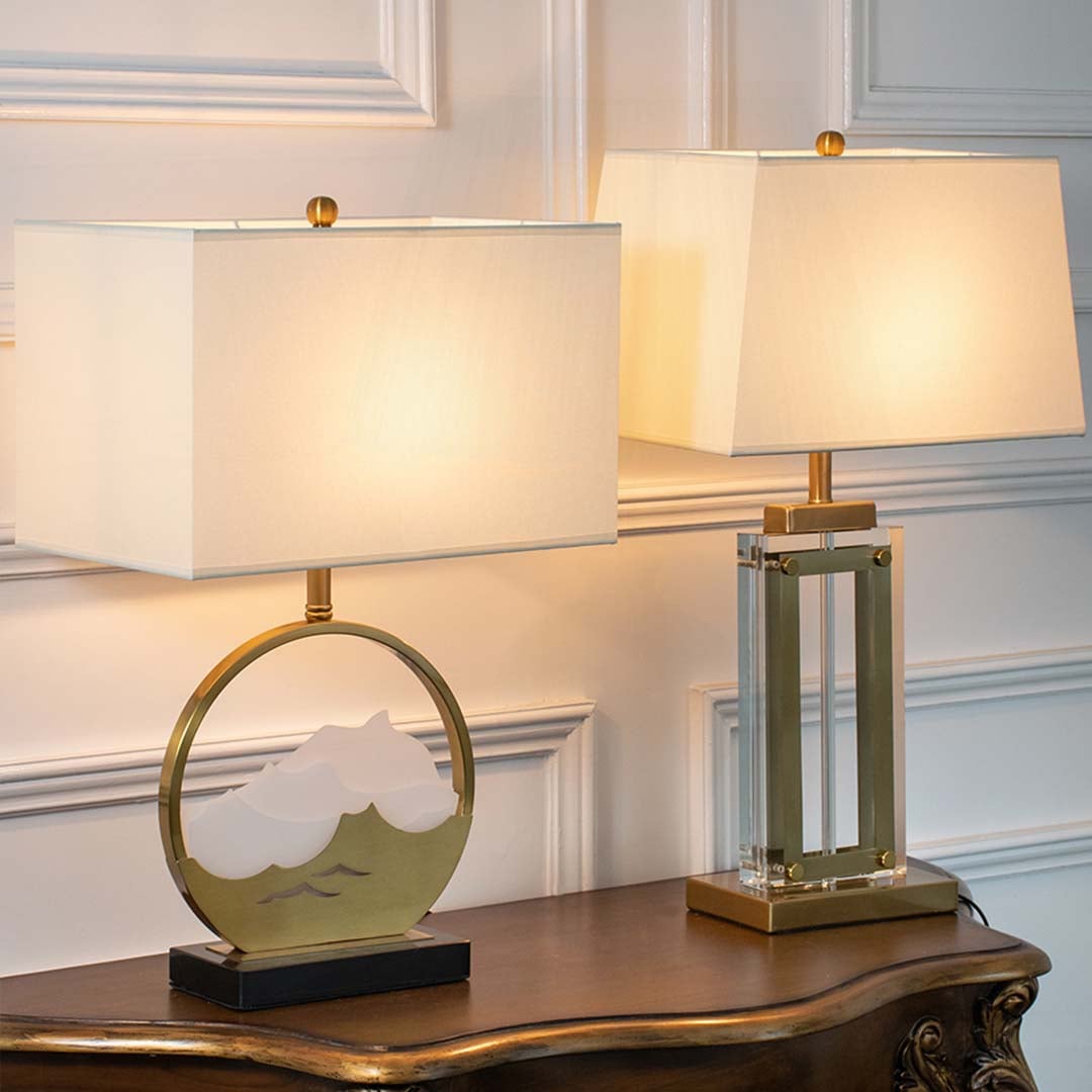 Two modern table lamps with gold accents and illuminated rectangular shades shown together highlighting stylish lighting options for contemporary decor.
