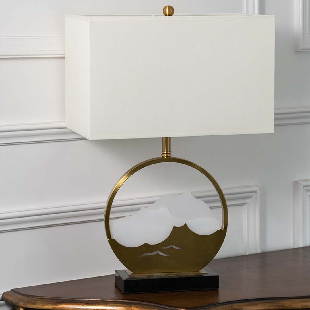 Gold metal table lamp with artistic mountain base and rectangular fabric shade displayed on a white background perfect for modern side table styling and decor.