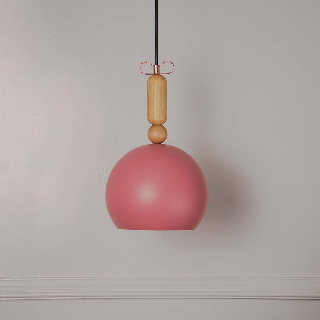 Terracotta dome pendant light with wooden accent displayed off on white background for modern home interiors.