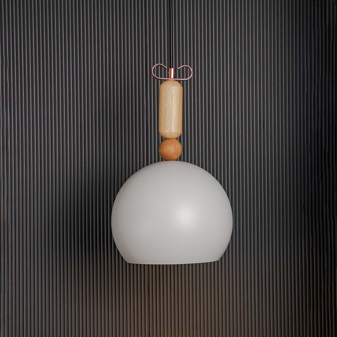 White dome pendant light glowing warmly on black background perfect for kitchen dining and living room lighting.
