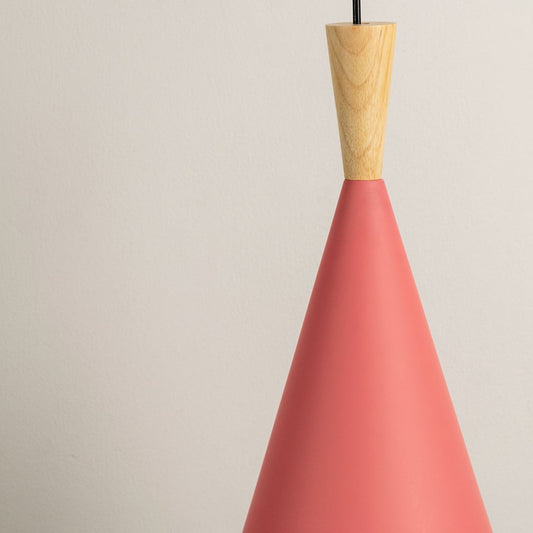 Detailed closeup of red cone pendant light with natural wood top showing smooth matte finish and sleek design.