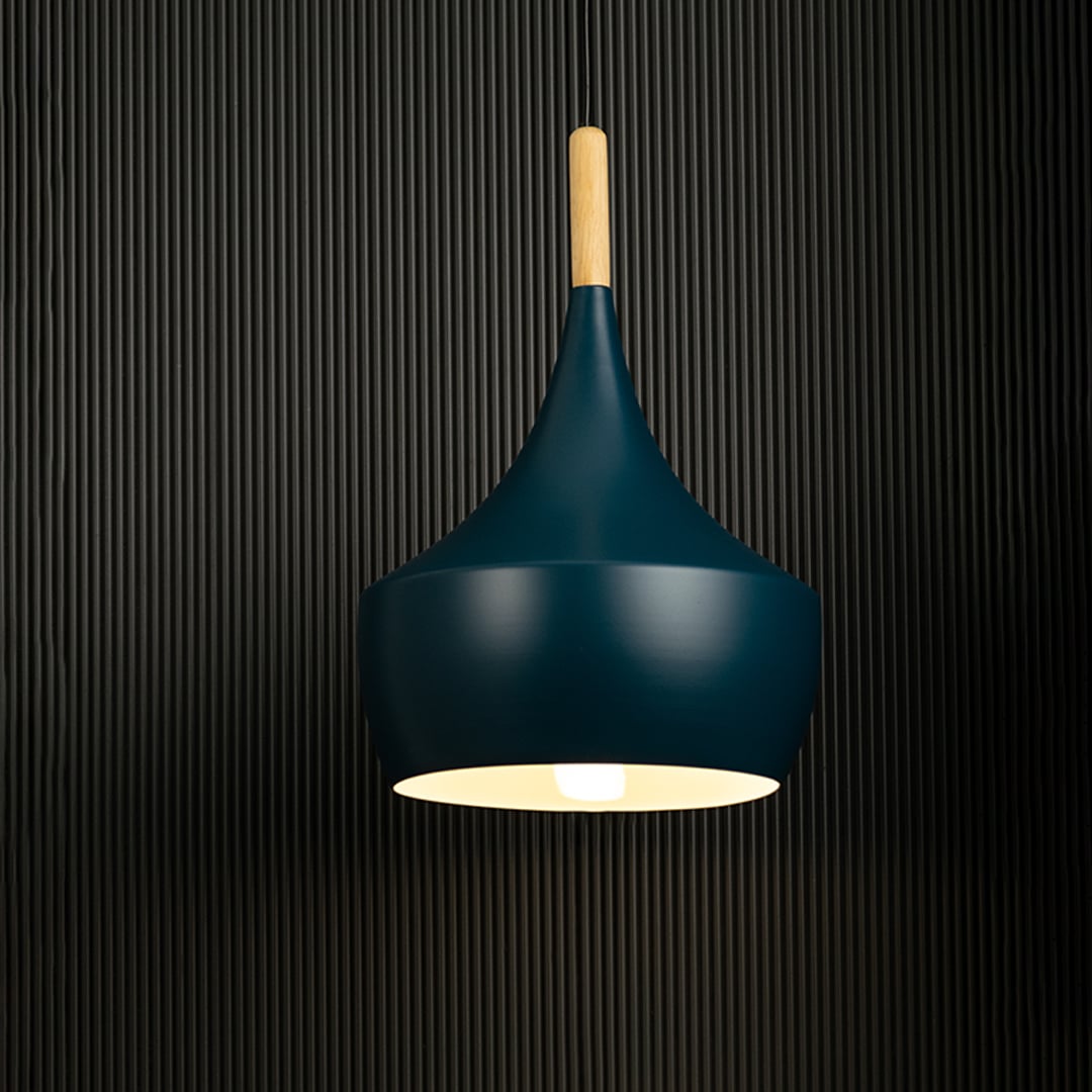 Vibrant pendant light glowing against a dark background showcases the sleek design and colorful shades.