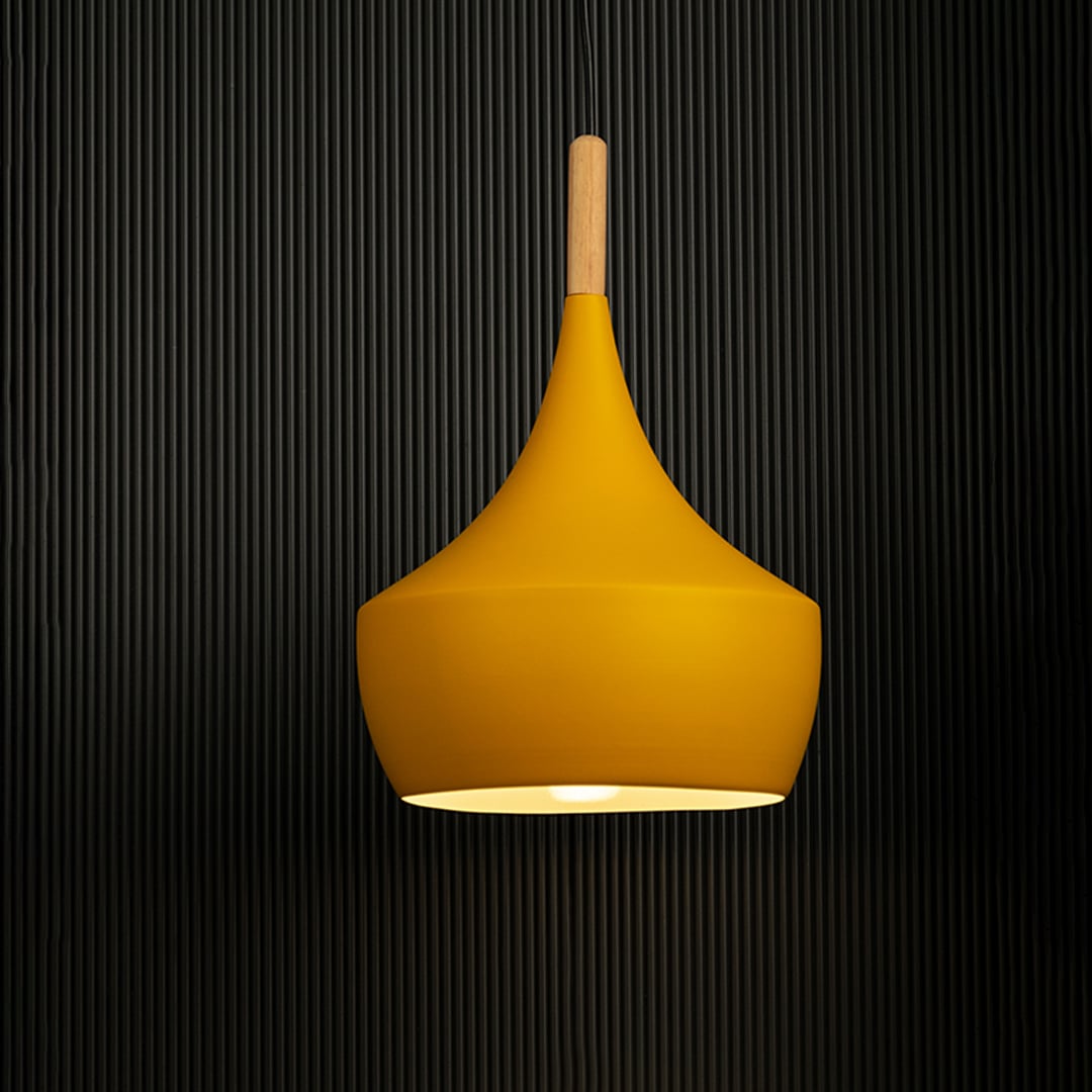 Yellow pendant light with wooden detail glowing against a black background is perfect for modern interior decor.