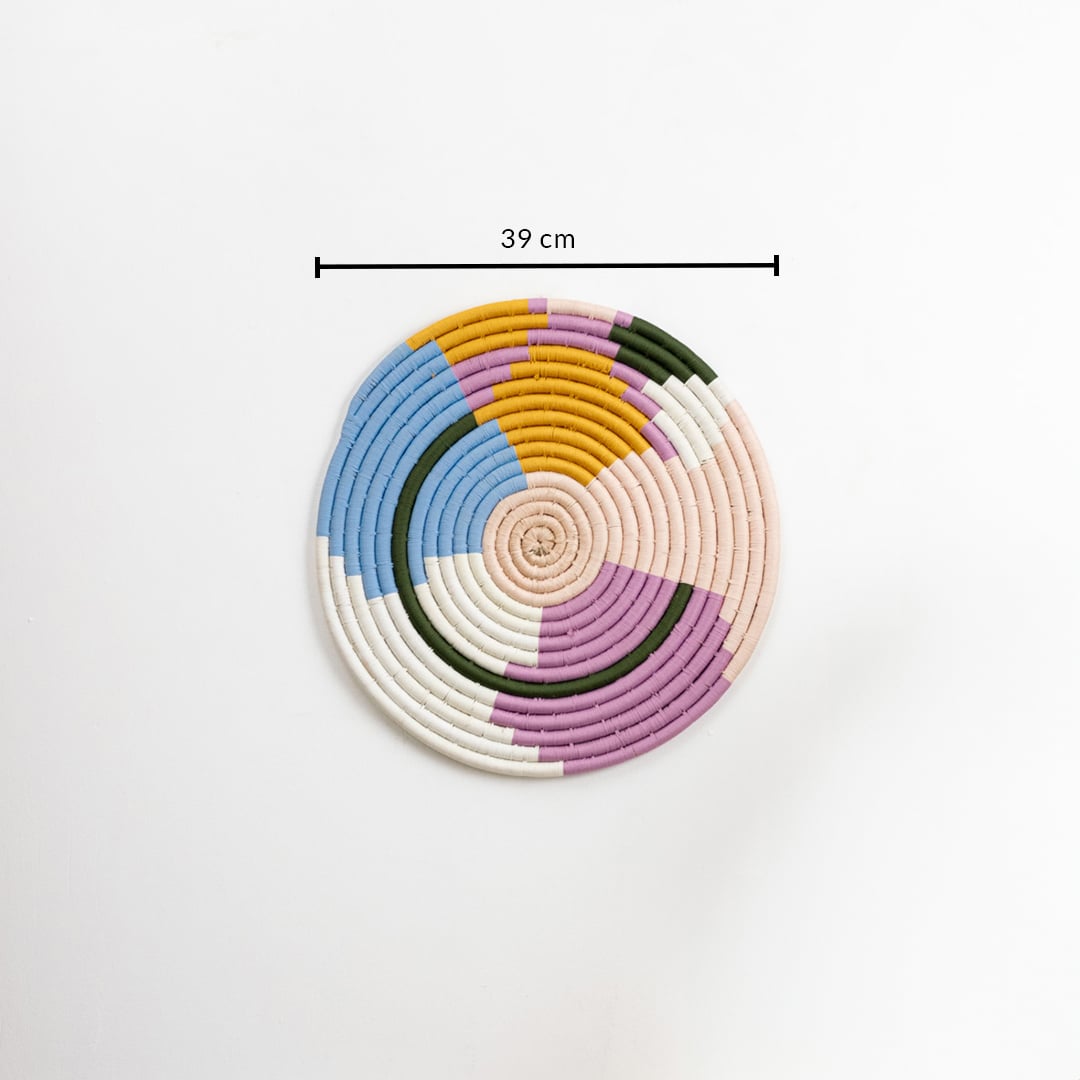 Cotton woven wall plate in pastel blue pink mustard green and cream tones displayed on a white background with 39 cm measurement for precise decorative wall sizing.