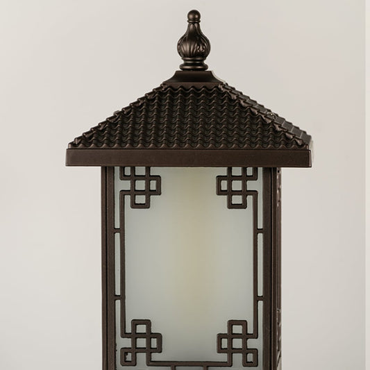 Black outdoor lantern Closeup seeded glass Light On showing the warm ambient glow and decorative pebbled glass panels detail.