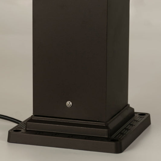 A closeup view of the outdoor bollard light highlighting the intricate geometric cutout design and frosted glass panel details that enhance its classic outdoor aesthetic.