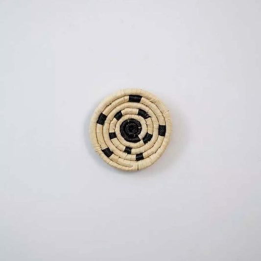 Round bamboo wall plate in yellow beige tones with woven spiral pattern perfect for boho natural wall decoration.