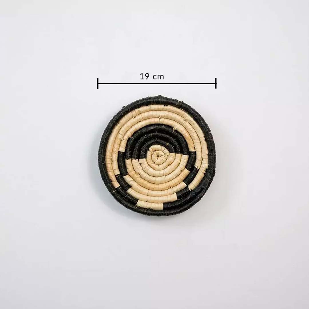 Round handwoven wall basket in natural and black fiber showing 18 cm diameter suitable for layered wall decor arrangements.