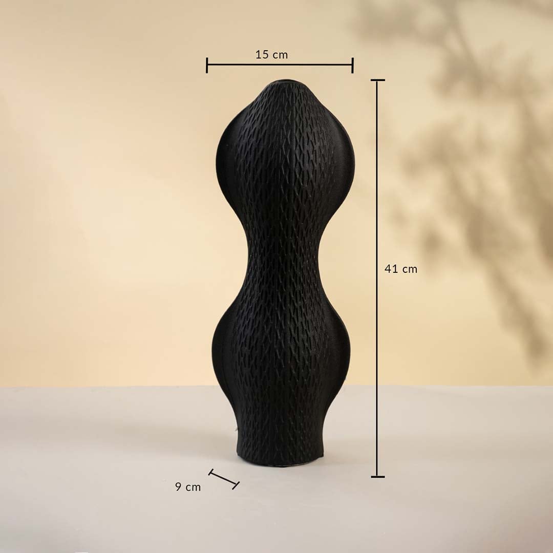 Black ceramic vase displayed on a neutral background measuring 41 cm in height 15 cm in width and 9 cm in base diameter.