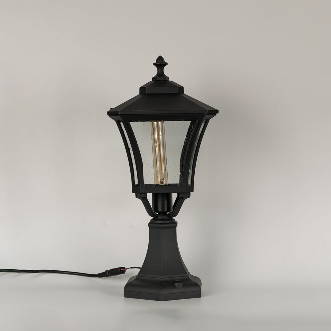 Black metal outdoor floor lantern shown unlit on white background highlighting classic design sturdy base and exterior Decor appeal.