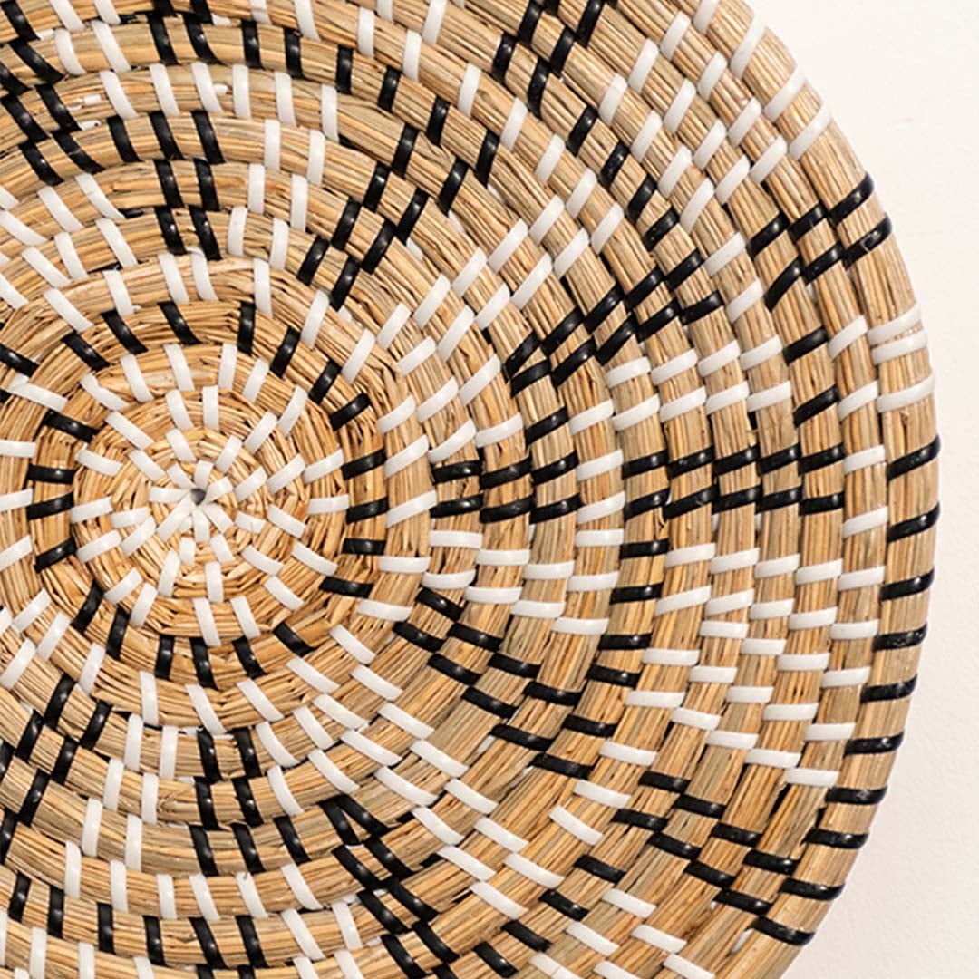 Detailed closeup of woven wall basket highlighting the intricate handwoven texture and natural seagrass material.