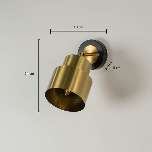 Cylindrical gold metal wall light showing 22 cm height 17 cm depth and 10 cm backplate suitable for bedside lighting.