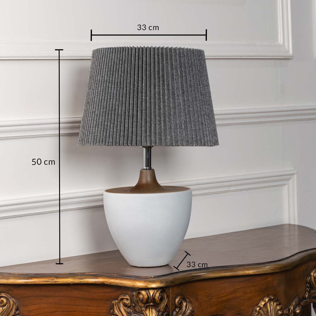 White ceramic table lamp shown with 50 cm height 33 cm shade width and 33 cm base width on a carved wooden console for accurate size reference.