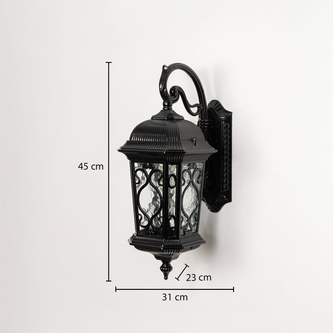 Black outdoor wall light with lantern design shown on white background with 45 cm height 31 cm width 23 cm depth.