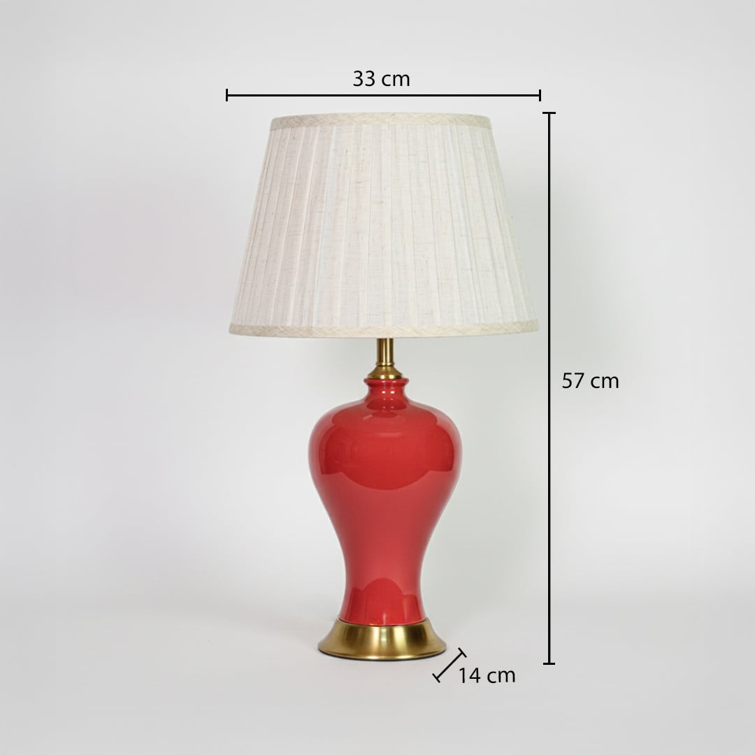 Red ceramic table lamp showing 57 cm height 33 cm shade width and 14 cm base size ideal for bedside placement.