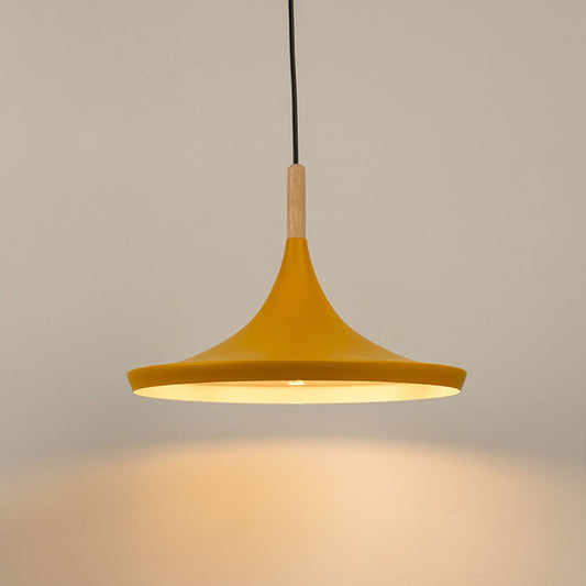 Yellow pendant light glowing softly against a clean white background highlighting its minimalist design and wooden accents.