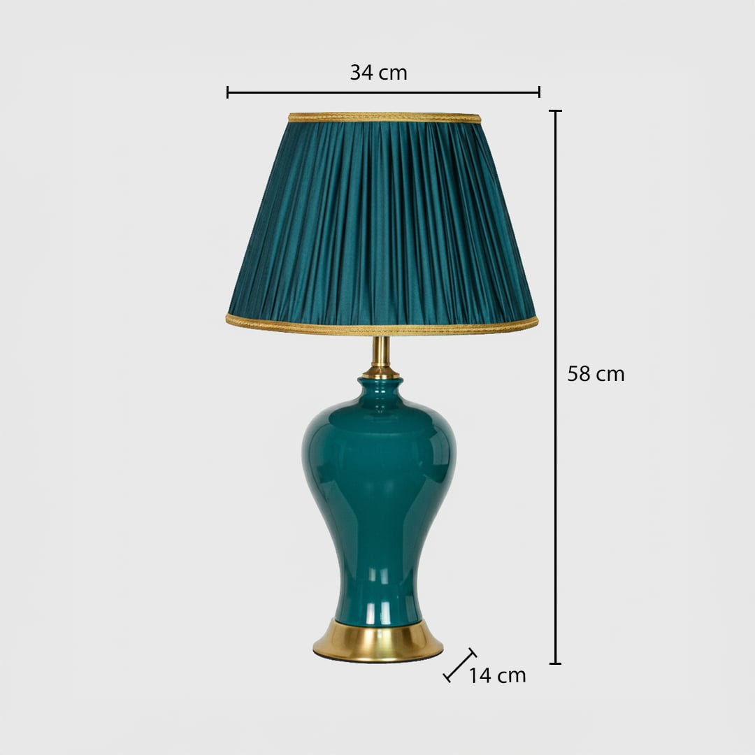 Teal ceramic table lamp showing 58 cm height 34 cm shade width and 14 cm base size ideal for bedside placement.